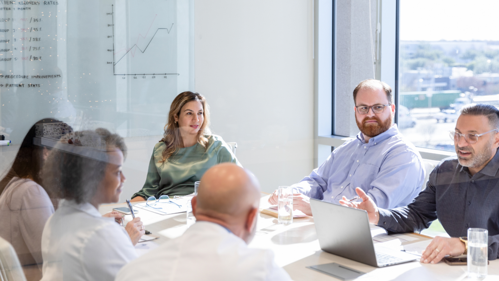 An image of a small business meeting where an outside CFO has been brought in to advise the business.