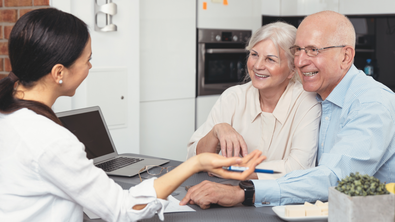 An image of a couple discussing adding a family trust to their estate plan