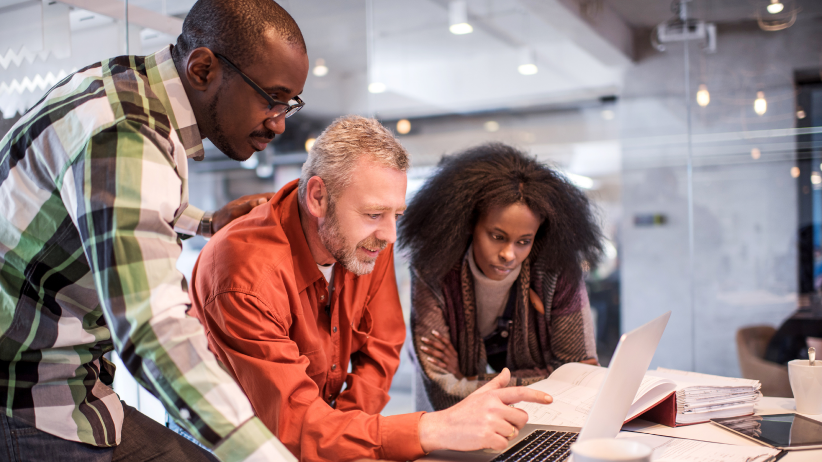 An image of some small business owners discussing the NAICS codes for their business