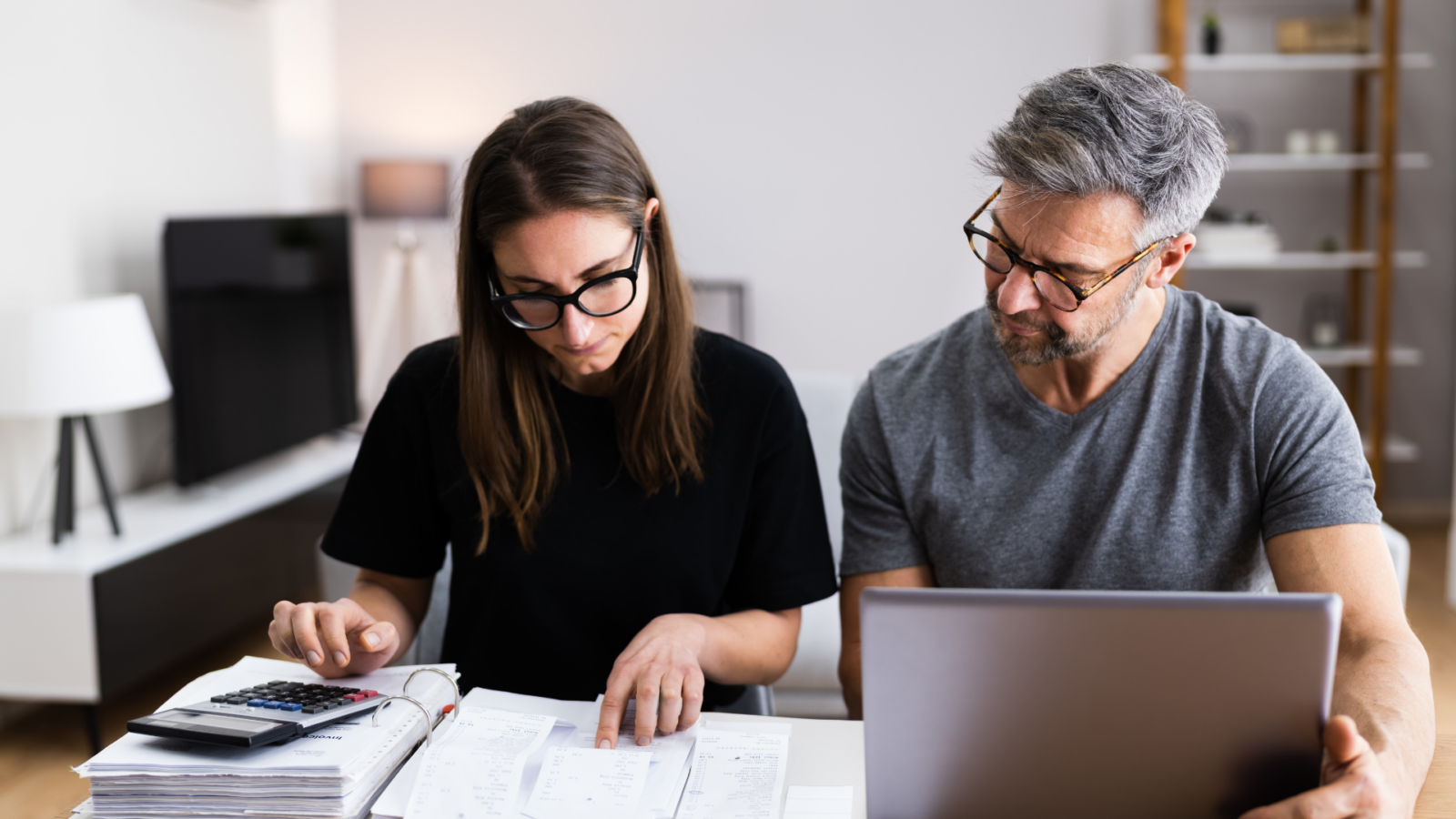 An image of two small business owners reviewing their operating budget