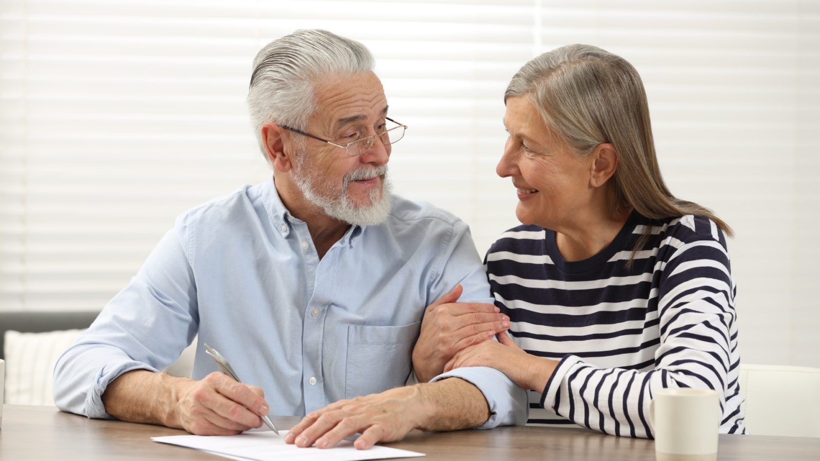 An image of an elderly couple reviewing their estate plan