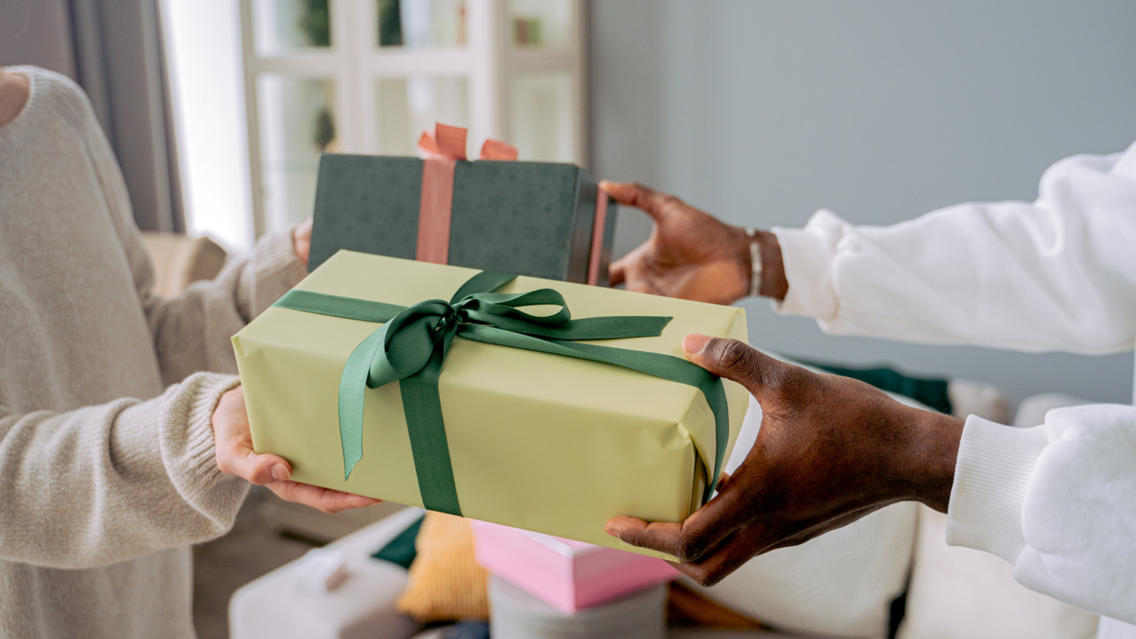 An image of two family member exchanging gifts