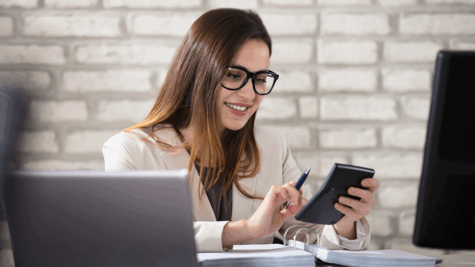An image of a small business owner who is reviewing the cash flow projections for her small business in North York.