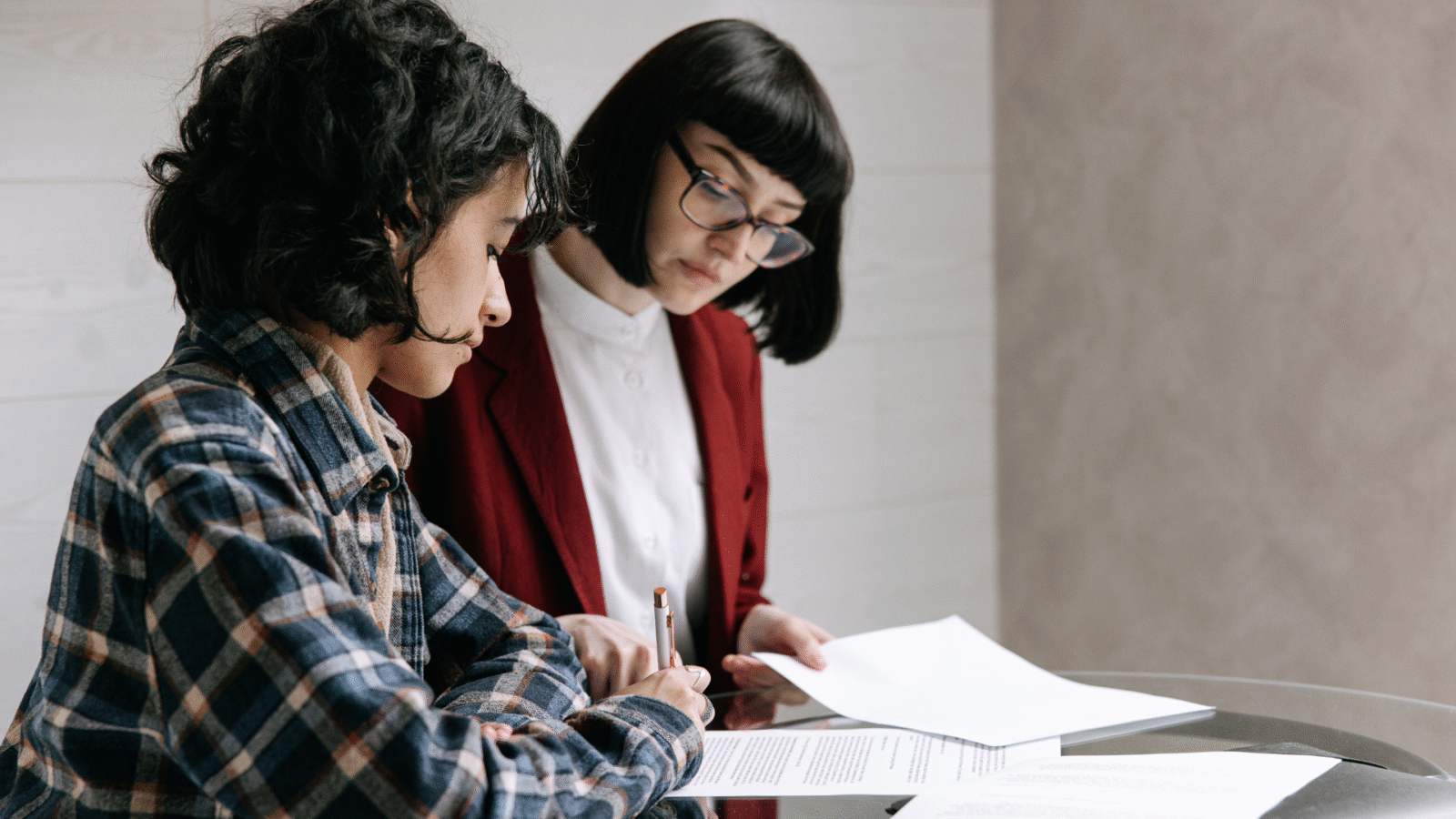 An image of a small business owner in North York Toronto, meeting with her estate planning advisor to help work out the details of her Living Trust
